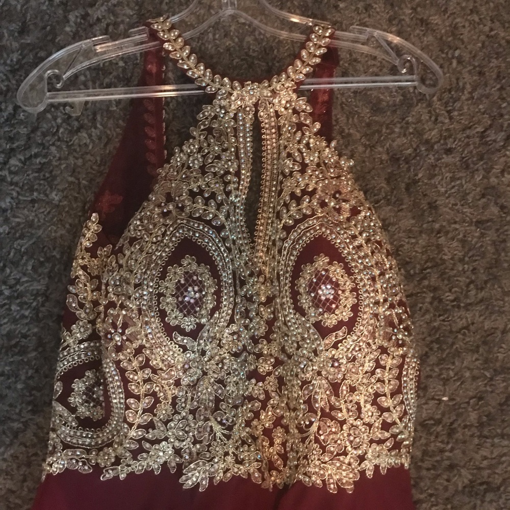 Burgandy open back formal gown with gold beading